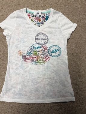 Disney White Short Sleeve V-Neck Tee with Multicolor Park Logo Stamps